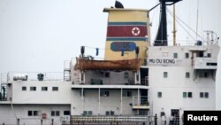 Crew members are seen on the 6,700-tonne freighter Mu Du Bong in the port of Tuxpan, April 9, 2015. 