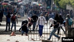 Student demonstrators are seen during a protest supporting a nationwide agriculture strike in Bogota, Colombia, April 28, 2014. 