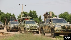 FILE - Nigerian soldiers patrol after gunmen suspected of belonging to the Islamic State West Africa Province (ISWAP) group raided a village, on Oct. 12, 2019. Nigeria has seen a surge of attacks by terror groups along its border with Niger in recent years.