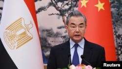 FILE - Chinese Foreign Minister Wang Yi speaks during a joint briefing with Egyptian Foreign Minister Badr Abdelatty in Beijing’s Diaoyutai State Guesthouse on Dec. 13, 2024.