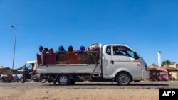 FILE - Displaced people fleeing from Wad Medani in Sudan's Jazeera state arrive in Gedaref in the country's east on December 18, 2023.