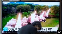 FILE - A TV screen shows a news program reporting on North Korea launching multiple rockets, at Seoul Railway Station in Seoul, South Korea, April 23, 2024.