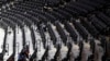 Workers clean the Wells Fargo Center after an NBA basketball game between the Philadelphia 76ers and the Detroit Pistons, Wednesday, March 11, 2020, in Philadelphia.