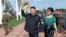 North Korean leader Kim Jong-Un and his wife Ri Sol-Ju attend the opening ceremony of the Rungna People's Pleasure Ground on Rungna Islet in Pyongyang in this July 25, 2012 photograph released by the North's KCNA.
