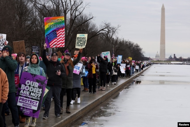 Protesters attend the People's March on the Washington Mall on Jan. 18, 2025, ahead of the inauguration of U.S. President-elect Donald Trump.