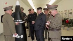 FILE - North Korean leader Kim Jong Un inspects nuclear warheads at an undisclosed location in this image taken from video. (KRT via Reuters)