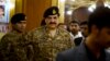 FILE - Pakistan's Army Chief General Raheel Sharif is seen arriving at a seminar in Gwadar, a town about 700 kilometers (435 miles) west of Karachi, Pakistan, April 12, 2016. On Thursday Sharif reportedly dismissed 11 top officers for corruption.