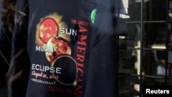 Eclipse T-shirts are shown for sale in store windows as the small town of Depoe Bay, Oregon, U.S., prepares for the coming solar eclipse, Aug. 19, 2017. 