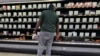 A shopper checks out nearly empty shelves in the lunch meat section of a Walmart, Sept. 25, 2024 in Tallahassee, Florida. A nationwide recall of meat and poultry products potentially contaminated with listeria has expanded to nearly 12 million pounds, Oct. 16, 2024. 