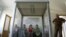 Election commission officials prepare a polling station on the eve of the parliamentary election in Tbilisi, September 30, 2012.