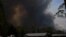 A home is seen as smoke from the Grose Valley Fire rises in the distance, at Bilpin, New South Wales, Australia, Dec. 21, 2019.