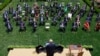 President Donald Trump holds up an executive order on police reform after signing it in the Rose Garden of the White House, in Washington, June 16, 2020.