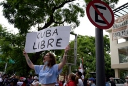 Cuban citizens take part in a demonstration against Cuban President Miguel Diaz-Canel's government outside the Cuban Embassy, in Mexico City on July 12, 2021.