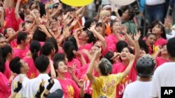 Dancers cheer during the National Day celebrations in Taipei, Taiwan, Saturday, Oct. 10, 2020. The National Day dates from the start of a 1911 rebellion against the Qing, China's last empire, that led to the establishment of the Republic of China,…