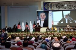 FILE - Afghan President Ashraf Ghani speaks at the Afghan Loya Jirga meeting in Kabul, Afghanistan, May 3, 2019.
