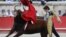 French matador Sebastien Castella performs a muleta pass to a Daniel Ruiz fighting bull, on September 16, 2012 during the Bullfighting wine harvest feria in Nimes, southern France.
