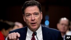 Former FBI director James Comey speaks during a Senate Intelligence Committee hearing on Capitol Hill, June 8, 2017, in Washington. 