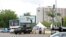 An armored vehicle is stationed outside the venue for the World Economic Forum on Africa (WEFA) meeting in Abuja, May 7, 2014. 