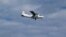 Handout picture taken by Japan Coast Guard shows a Chinese state-owned plane flying in airspace over the disputed island, called the Senkakus in Japanese and Diaoyus in Chinese, in the East China Sea, December 13, 2012