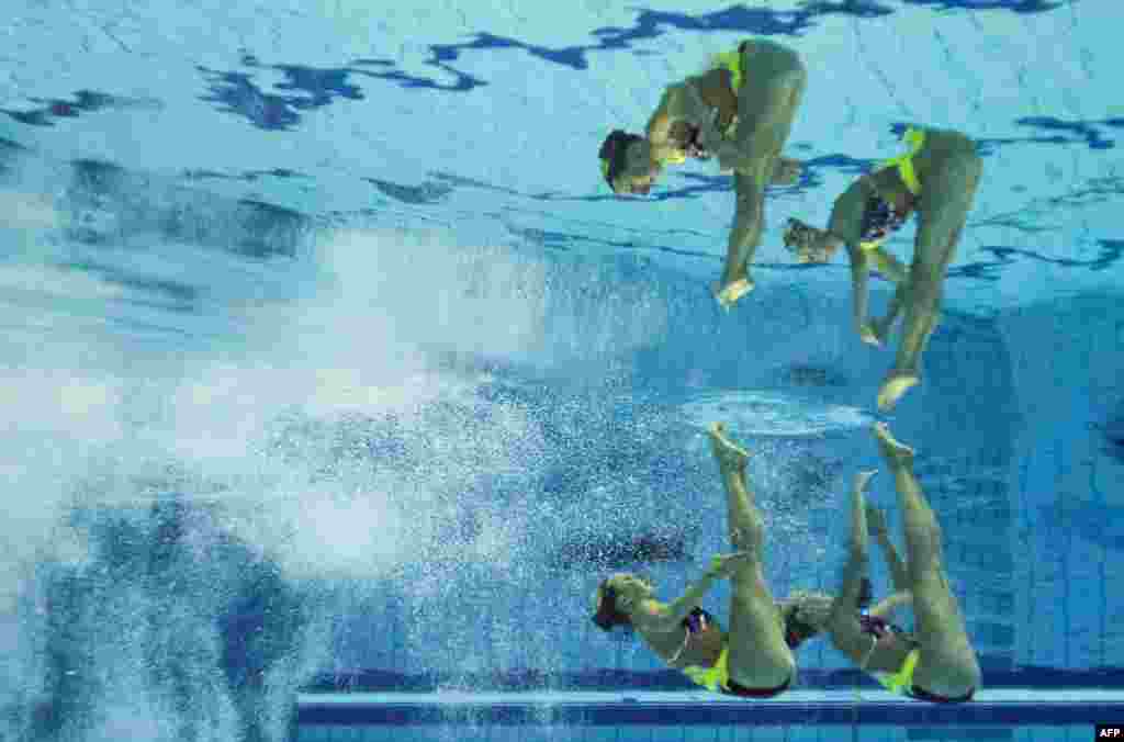 This picture taken with an underwater camera shows the German team competing in the synchronised swimming duet free preliminary event at the 32nd LEN European Swimming Championships in Berlin.