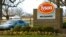 FILE - A car passes in front of a Tyson Foods Inc. sign at Tyson headquarters in Springdale, Ark., Jan. 29, 2006.