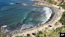 FILE - Royal Palms Beach in the San Pedro area of Los Angeles is protected by boulders placed there to forestall erosion. 