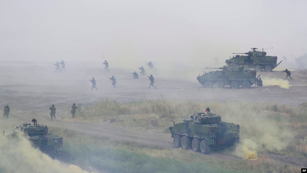 FILE - Soldiers participate in the annual Han Kuang military exercises that simulate an anti-landing operations near the coast in New Taipei City, northern Taiwan, July 27, 2023. 