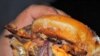This Krispy Kreme burger is a bacon cheeseburger between two doughnuts.