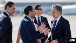 Cyprus' President Nikos Christodoulides and Foreign Minister Constantinos Kombos welcome U.S. Secretary of State Antony Blinken to Larnaca airport, Nov. 5, 2023.