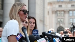 Jennifer Araoz, an alleged victim of Jeffrey Epstein, speaks to the media at Federal Court in New York, Aug. 27, 2019. 