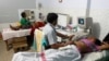 Indian gynaecologists conduct ultrasound examinations on pregnant women at a government-run hospital, March 17, 2015. A new study from New Zealand, has found that women who lie on their backs late in their pregnancies could be increasing their risk of stillbirth.