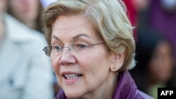 Democratic presidential candidate Massachusetts Senator Elizabeth Warren announces the suspension of her presidential campaign in front of her Cambridge, Massachusetts home on March 5, 2020. - Elizabeth Warren, once a frontrunner in the Democratic…