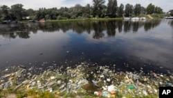 FILE - Dumped waste lies along the bank of the river Sava in Belgrade, Serbia, June 5, 2020. Only 37% of Europe's surface water bodies achieved "good" or "high" ecological status, a measure of aquatic ecosystem health, an EEA report said Oct. 15, 2024.