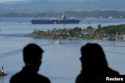 A view of the U.S. aircraft carrier USS Gerald R. Ford in the Oslo Fjord, seen from Ekebergskrenten, Norway, May 24, 2023. (Javad Parsa/NTB/via REUTERS)