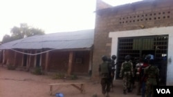 FILE - Soldiers enter the gate of Bama Prison, Maiduguri, Borno state, Nigeria, May 7, 2013.