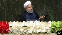 FILE - Iranian President Hassan Rouhani speaks during the inauguration of the new parliament, in Tehran, Iran, May 28, 2016.