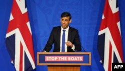 FILE — Britain's Prime Minister Rishi Sunak hosts a press conference inside the Downing Street Briefing Room, on December 7, 2023, after his government signed a new treaty with Rwanda.