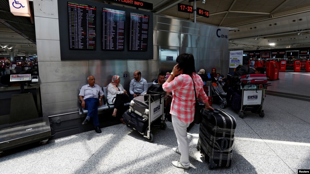 Passengers wait for their flights at Turkey's largest airport, Istanbul Ataturk, following yesterday's blast, June 29, 2016. 