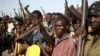 FILE - Jikany Nuer White Army fighters hold their weapons in Upper Nile State, February 2014.