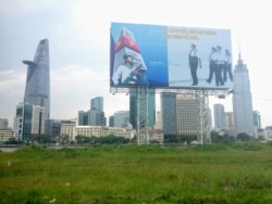 FILE - A billboard in front of the Ho Chi Minh City skyline reminds residents of Vietnam’s territorial claims in the South China Sea. (Ha Nguyen/VOA)