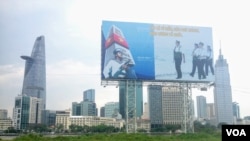 A billboard in front of the Ho Chi Minh City skyline reminds residents of Vietnam’s territorial claims in the South China Sea. (VOA/Ha Nguyen)