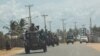 FILE - A military convoy of South Africa National Defense Forces patrols in Pemba, Aug. 5, 2021. The Southern African Development Community bloc is rallying behind neighboring Mozambique, sending troops to battle jihadists wreaking havoc in the north.