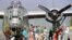 Spectators look at a B-24 Liberator, World War II bomber "The Dragon and His Tail" at the Knapp Airport in Berlin, Vermont. 