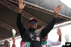 FILE - Nigeria's Labour Party's Presidential Candidate Peter Obi, waves to his supporters during an election campaign rally at the Tafawa Balewa Square in Lagos Nigeria, Saturday, Feb. 11, 2023.