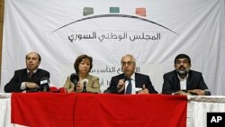 From left, Ahmed Ramadan, Bassma Kodmani, Abdulbaset Seida and Imad Aldeen Rashid speak as a group of Syrian opposition members announced a Syrian National Council in Istanbul, Turkey (File Photo - September 15, 2011).