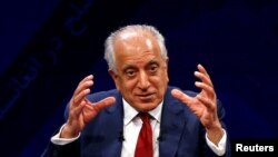 FILE - U.S. envoy for peace in Afghanistan Zalmay Khalilzad speaks during a debate at Tolo TV channel in Kabul, Afghanistan, April 28, 2019. 