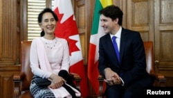 FILE - Canada's Prime Minister Justin Trudeau meets with Myanmar State Counsellor Aung San Suu Kyi in Ottawa, Ontario, June 7, 2017.