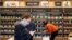 FILE - Shoppers roam through an Amazon Go store, currently open only to Amazon employees, in Seattle, Washington, April 27, 2017.
