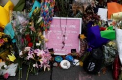 FILE - A flower tribute is seen outside Al Noor mosque after an attack by a suspected white supremacist during Friday prayers on March 15, in Christchurch, New Zealand, March 27, 2019.