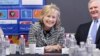 Hillary Clinton, center right, Randy Falco, president and CEO of Univision, and New York City Mayor Bill de Blasio, meet with parents and students from the East Harlem Council for Human Services Bilingual Headstart Program, Feb. 4, 2014, in New York. 